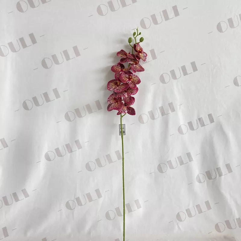 white faux phalaenopsis centerpiece
