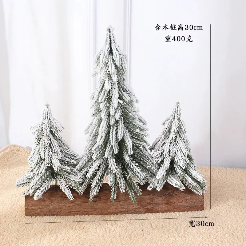Snow-flocked artificial tree for festive display